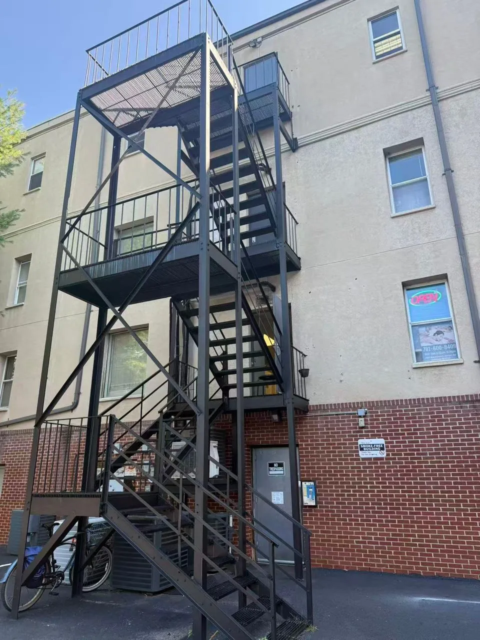 Exterior metal staircase leading to the second floor of the building