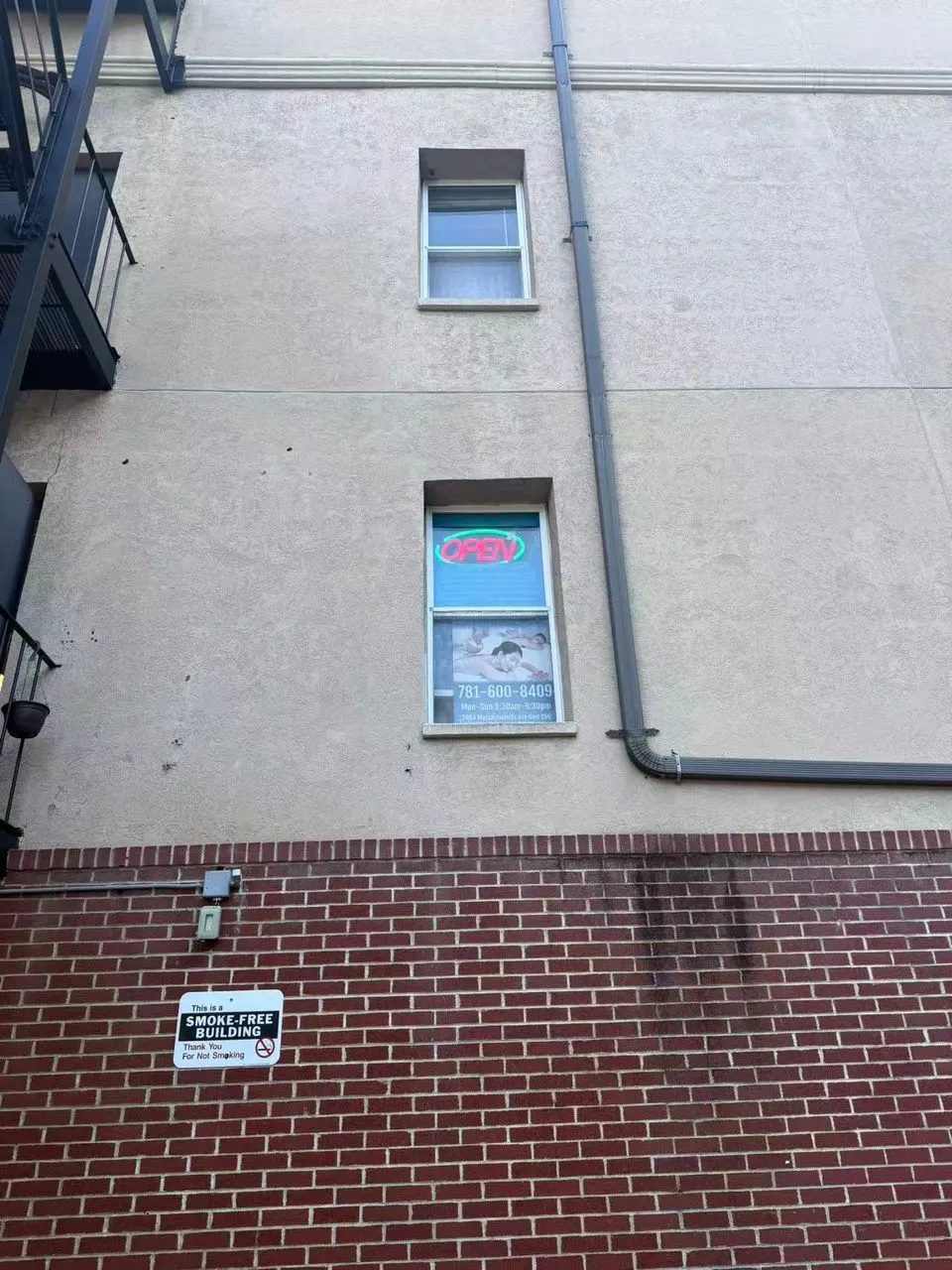 Exterior metal staircase leading to the second floor of the building